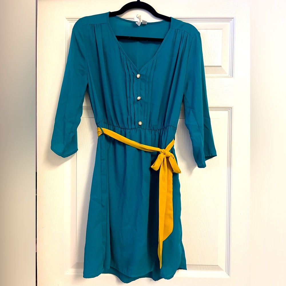 Knee length teal dress with 3/4 length sleeves